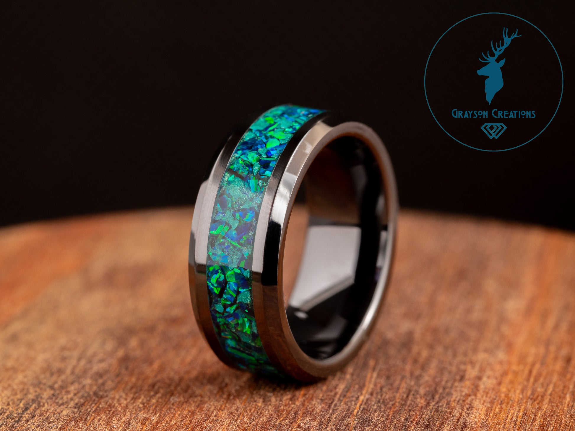 a ring with a green and blue opal inlay