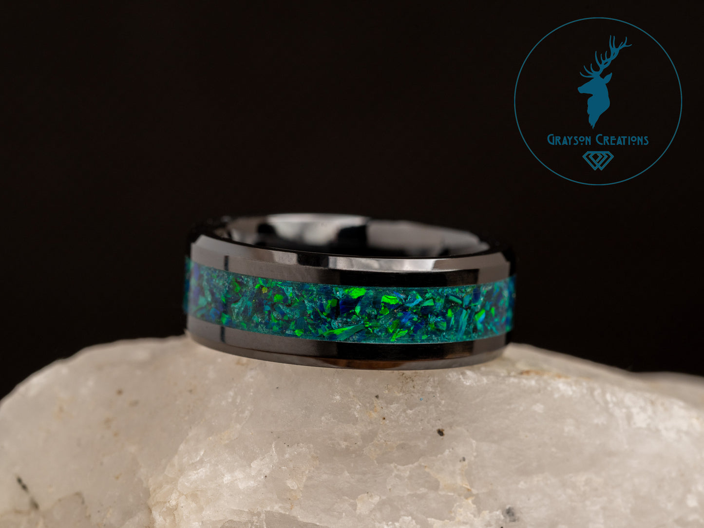 a ring with a green and blue opal inlay