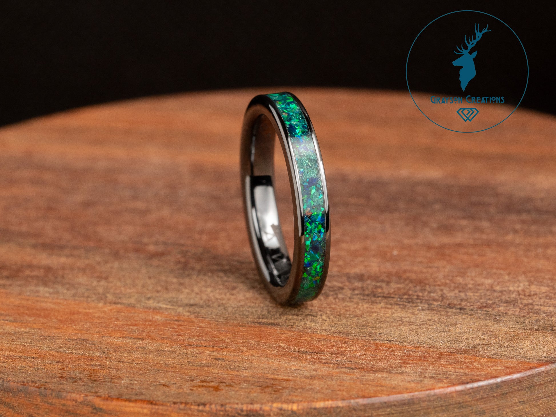 a ring with a green and blue opal inlay